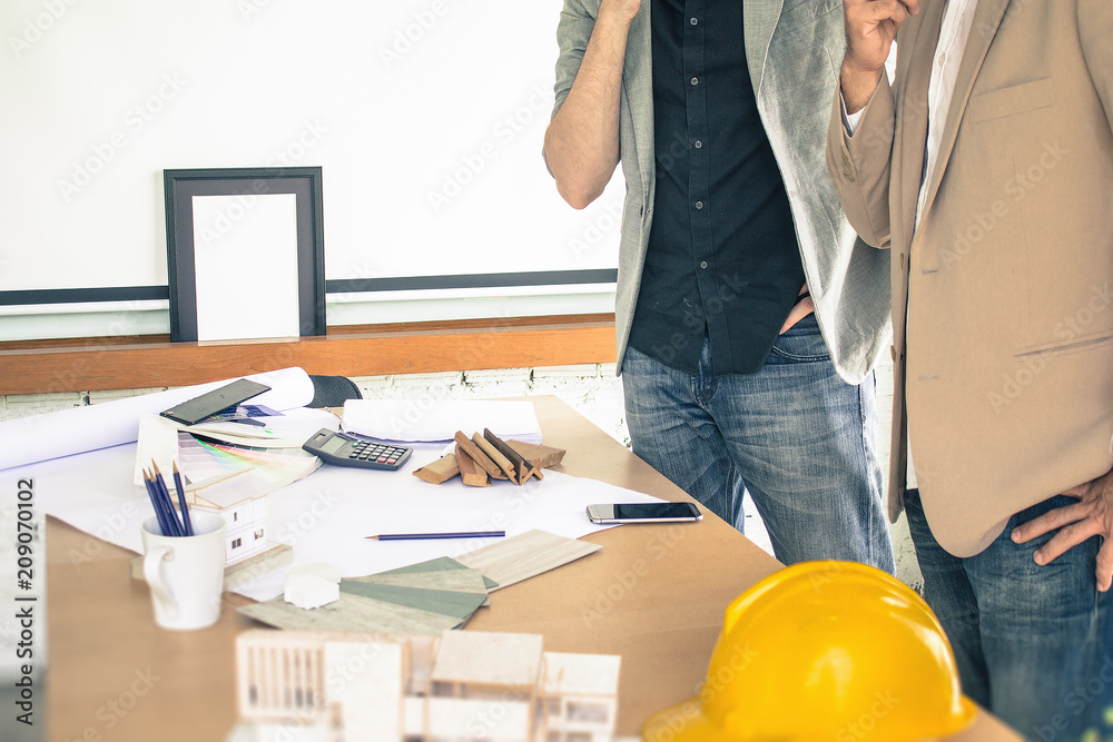 City planners drawing new concept design for construction project. City planners drawing new concept design for construction project.