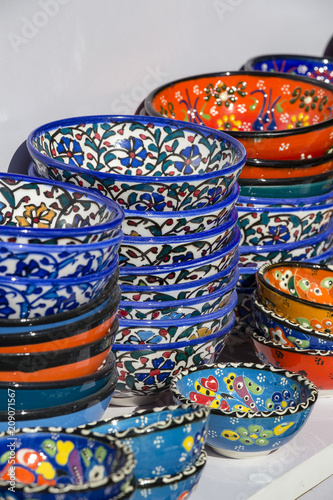 Selling colorful bowls in the shop of traditional Arabian market at Souq Waqif market in Doha, Qatar