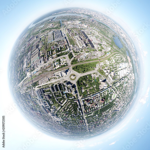 Aerial view of square in the city with roundabout traffic, streets and buildings with green trees and rails. Panoramic 360 degrees of the panet.