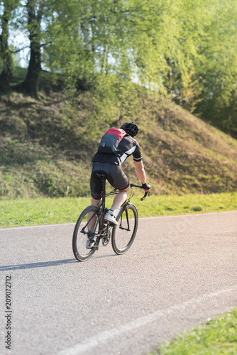triathlete cycling on a bicycle at the training road in Moscow © Mak