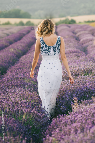 Woman walking at lavender field