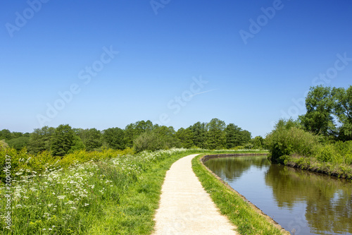 Trent and Mersey canal with towpath in Cheshire England United Kingdom