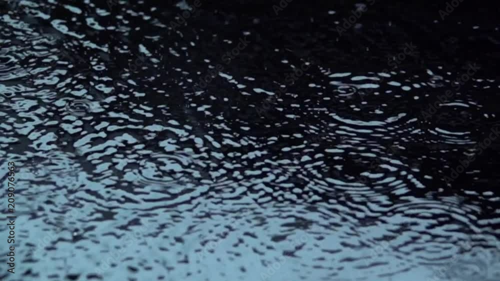 Water rain drops on Black Background. Slow motion. Macro. Water rain drops on Black Background. Slow motion. Macro.