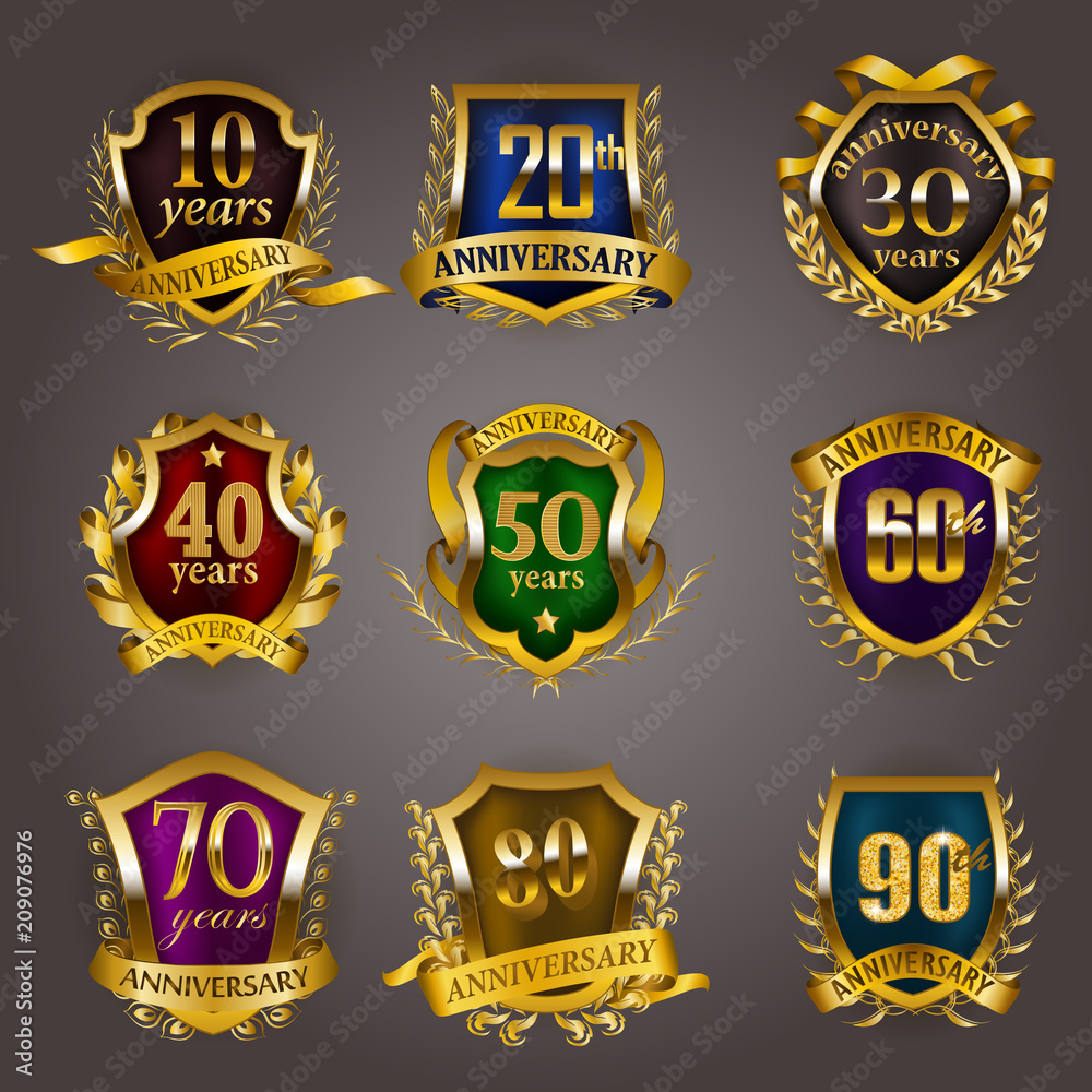 Set of gold anniversary badges with laurel wreaths, shield, numbers. Decorative emblem of jubilee on gray background. Filigree element, frame, border, icon, logo for web, page design in vintage style