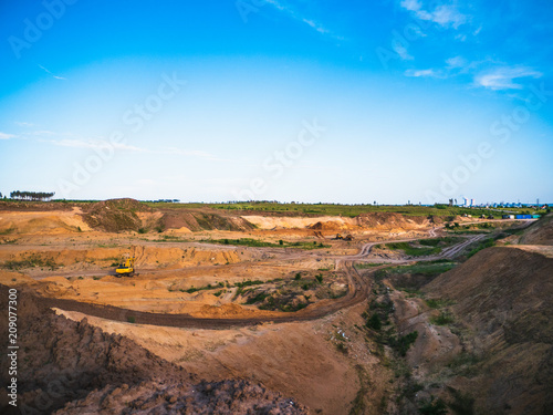 Industrial sand quarry with hydraulic excavator machinery for construction. industrial landscape, construction industry