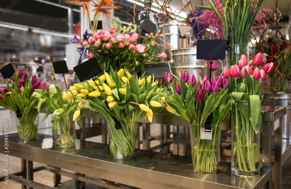 Assortment of beautiful tulips in flower shop