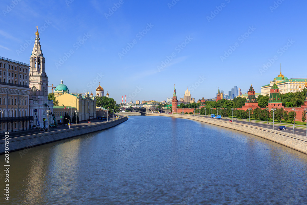 Moskva river near Moscow Kremlin on a blue sky background in sunny summer morning