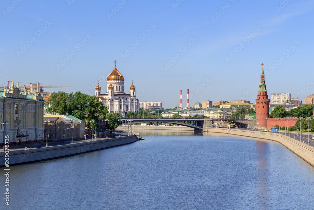 View of Moskva river with Moscow Kremlin and Cathedral of Christ the Saviour in sunny summer morning View of Moskva river with Moscow Kremlin and Cathedral of Christ the Saviour in sunny summer morning