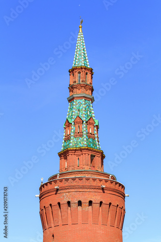 Beklemishevskaya tower of Moscow Kremlin on a blue sky background in sunny summer morning photo