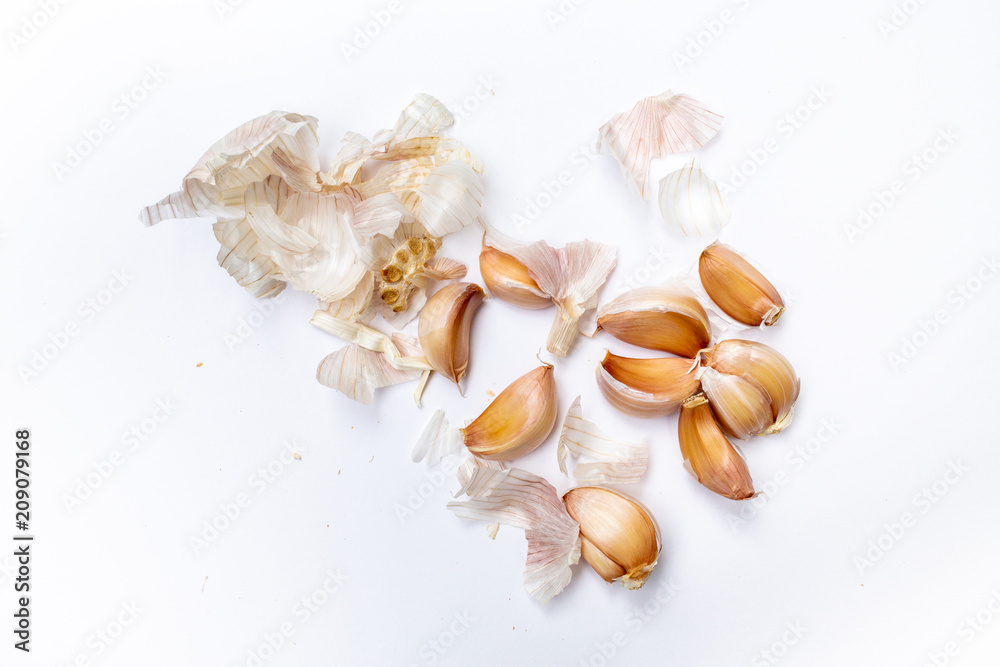 Garlic cloves with bumpy ( Allium sativum ) peeled isolated on white background, Pattern concept Garlic cloves with bumpy ( Allium sativum ) peeled isolated on white background, Pattern concept