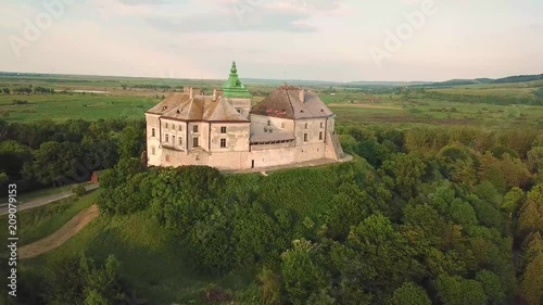 Olesko Palace from the air. Reserve. Summer park on the hills. Aerial view of the Olesky Castle, Ukraine. photo