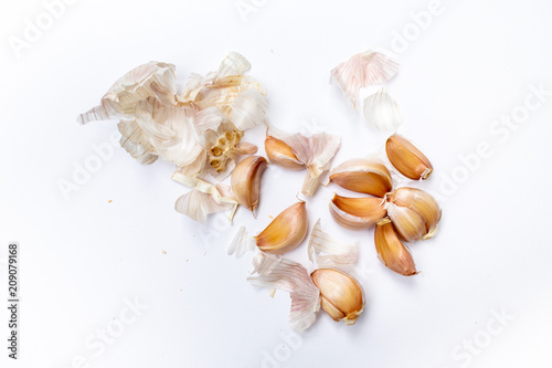 Garlic cloves with bumpy ( Allium sativum ) peeled isolated on white background, Pattern concept