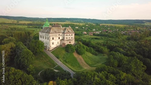 Olesko Palace from the air. Reserve. Summer park on the hills. Aerial view of the Olesky Castle, Ukraine. photo