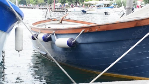 A small motor boat moored at the port.