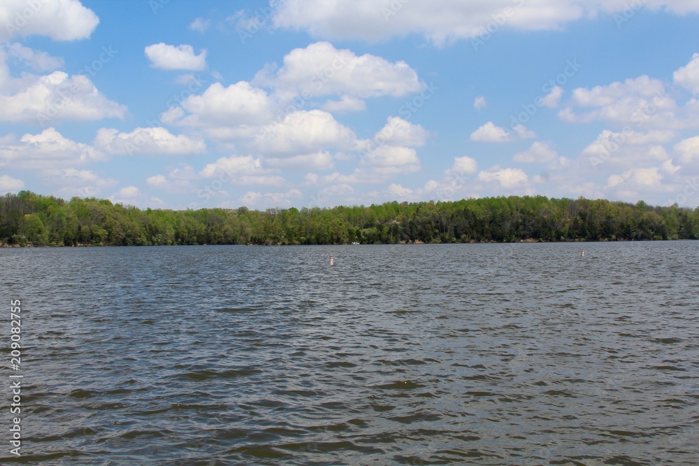 The calm waters of the lake on a beautiful sunny day.