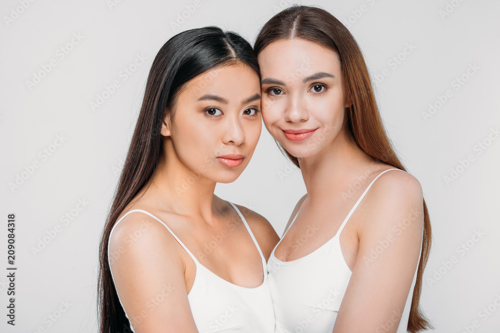 beautiful multiethnic women in white bra, isolated on grey beautiful multiethnic women in white bra, isolated on grey