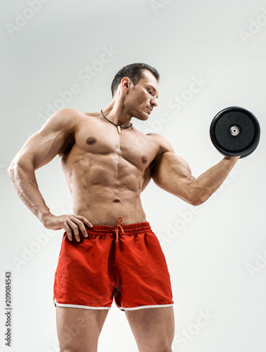 Fototapeta bodybuilder on grey background