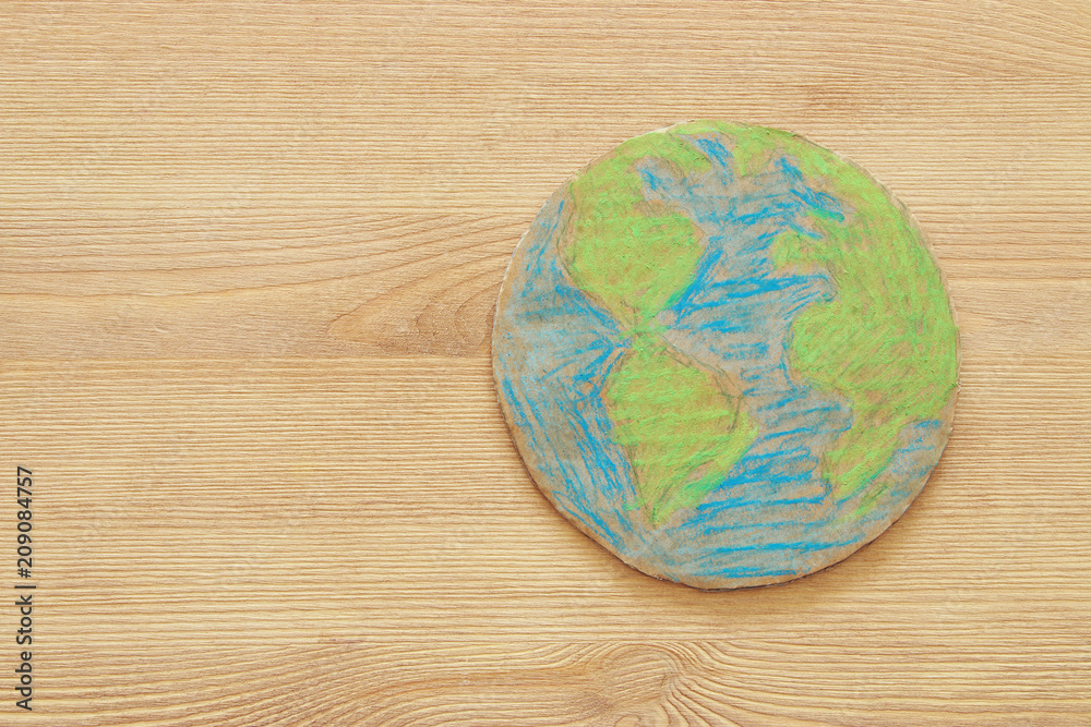 top view image of earth globe over wooden table. top view image of earth globe over wooden table.