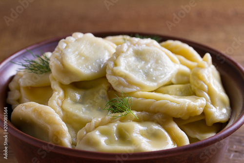 Dumplings, filled with cottage cheese (farmer cheese). Varenyky, vareniki, pierogi, pyrohy