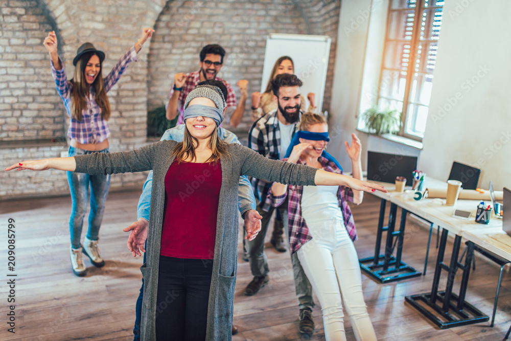 Fototapeta premium Business people making team training exercise during team building seminar, play a game of trust