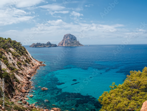 paisaje bucolico y hermoso, del mar mediterraneo y los islotes de  Es Vedra y Es Vedranell, desde el acantilado del parque natural de Cala D´hort en ibiza, España photo