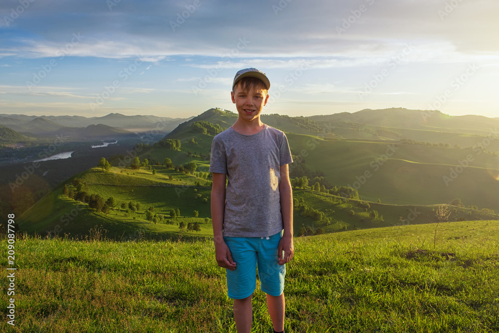 Young explorer at the sunset in Altai mountains