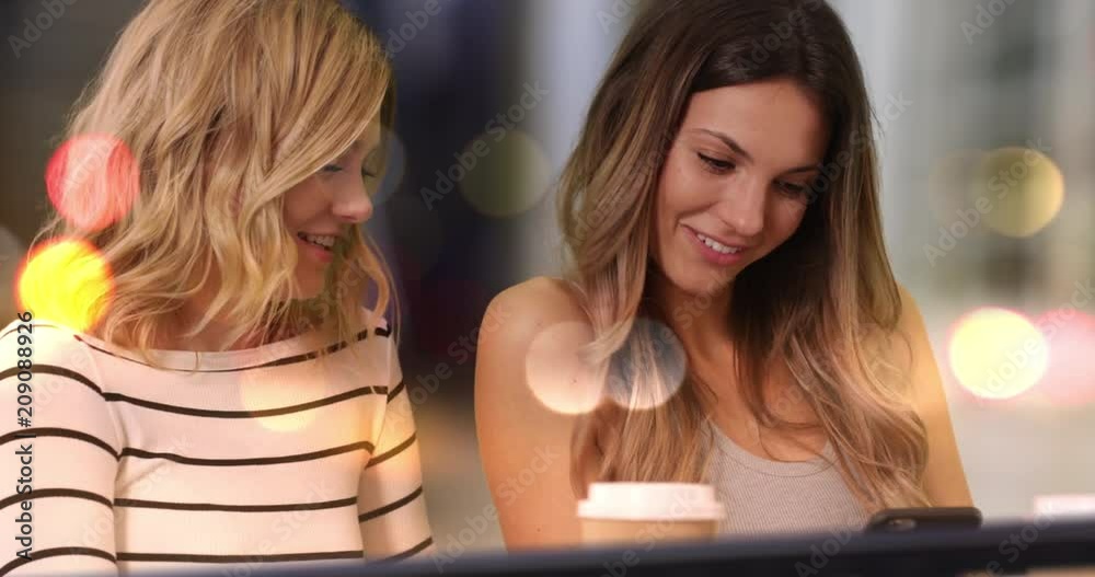 Close-up of two lovely girls taking selfie with smart phone indoors city store, Close view of two friends being social and using cell phone to take selfie in front city street, 4k