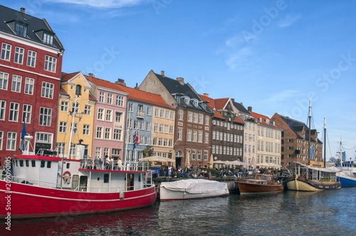 The famous Nyhavn pier of the Danish capital Copenhagen with boats, ships, tourists and people in the Old Town district, Denmark. Europe. © Lorena Tempera