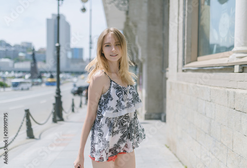 Outdoors portrait of beautiful young woman. Selective focus.