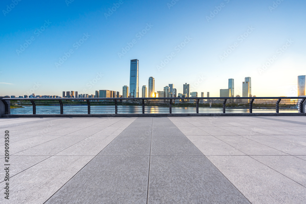 empty  square with panoramic city skyline