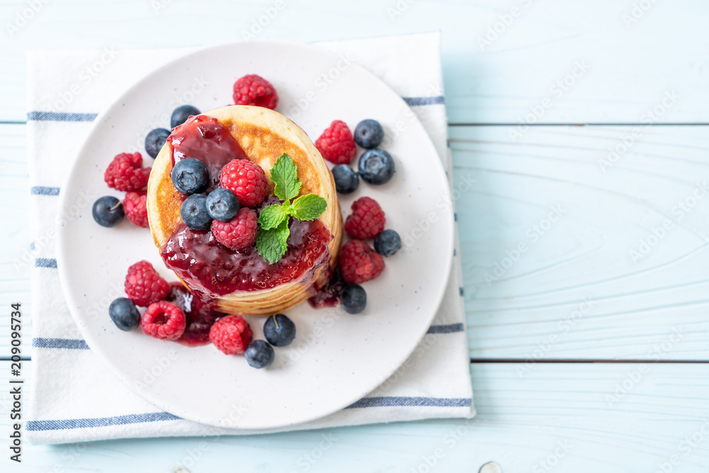 pancake with fresh raspberries and blueberries pancake with fresh raspberries and blueberries