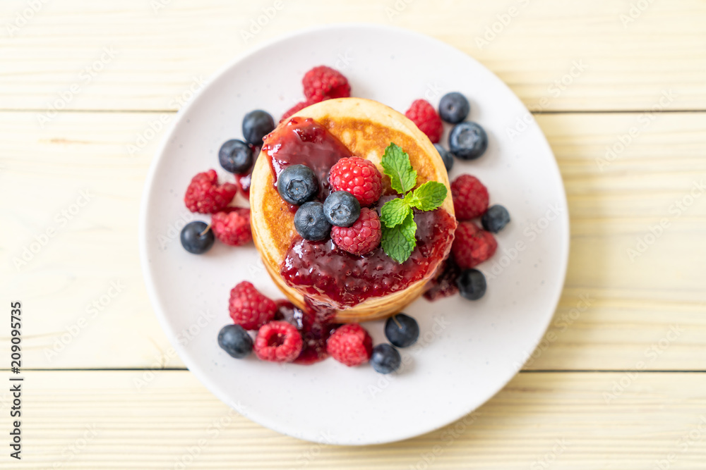 pancake with fresh raspberries and blueberries pancake with fresh raspberries and blueberries