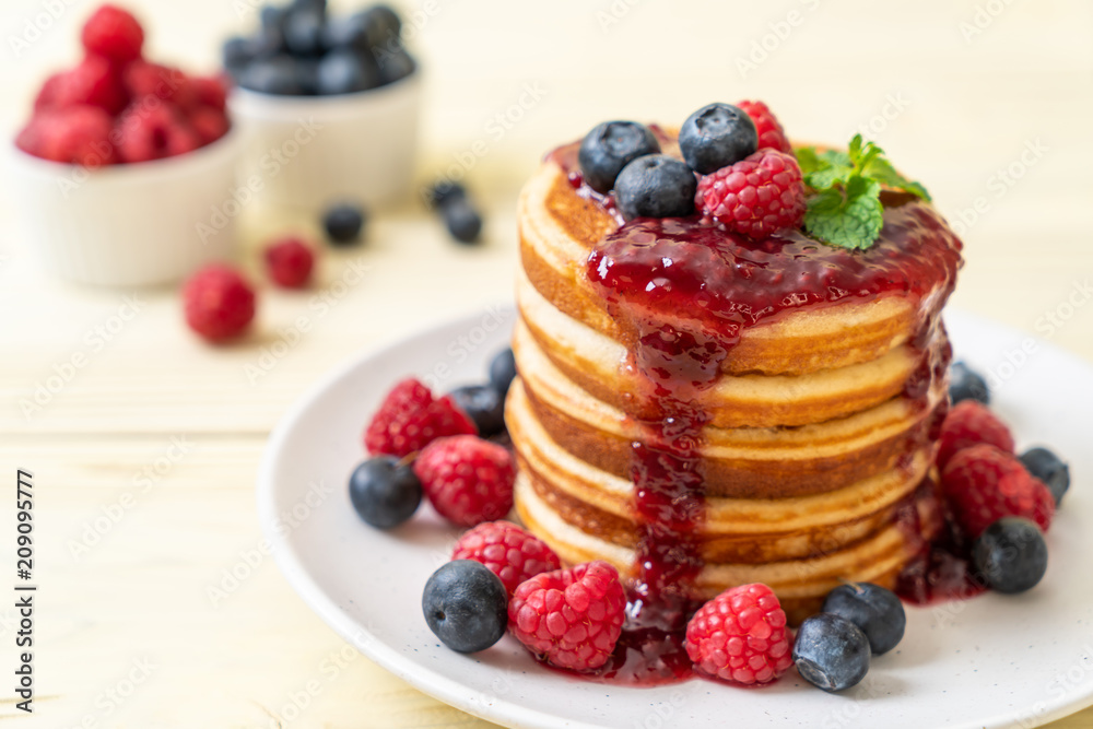 pancake with fresh raspberries and blueberries pancake with fresh raspberries and blueberries