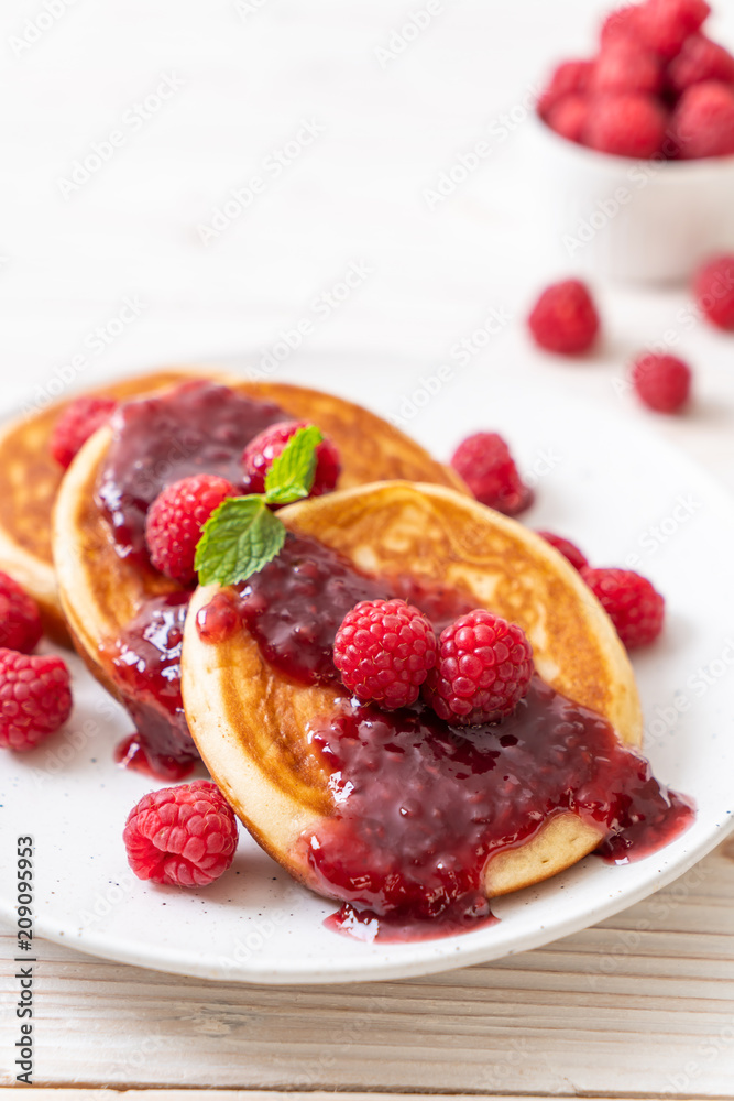 pancake with fresh raspberries and raspberry sauce pancake with fresh raspberries and raspberry sauce