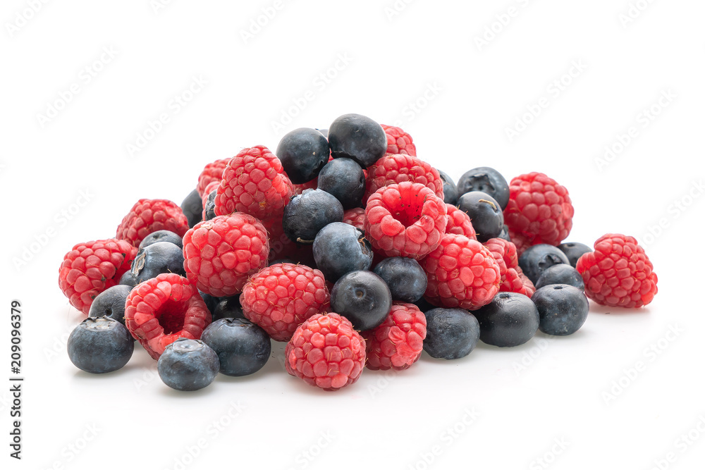fresh raspberries and fresh blueberries on white background fresh raspberries and fresh blueberries on white background
