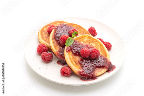 pancake with fresh raspberries and raspberry sauce