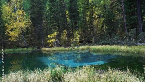 Blue Geyser lake in Altai mountains in rainy Autumn day 