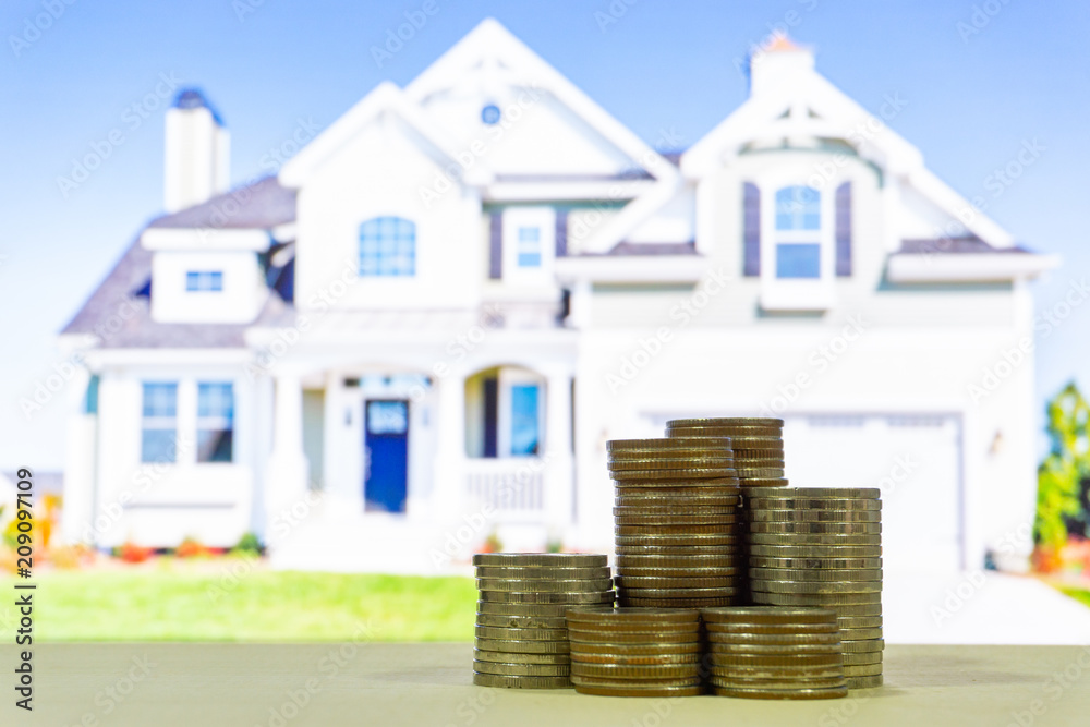 Stack of money with blur housing on background , finance concept,saving money concept,save money. Stack of money with blur housing on background , finance concept,saving money concept,save money.