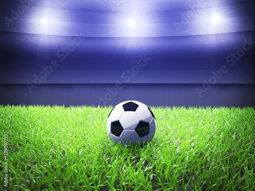 Football on the green grass of soccer stadium 