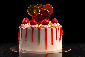 Raspberry cream mousse cake no baked cheesecake on black background