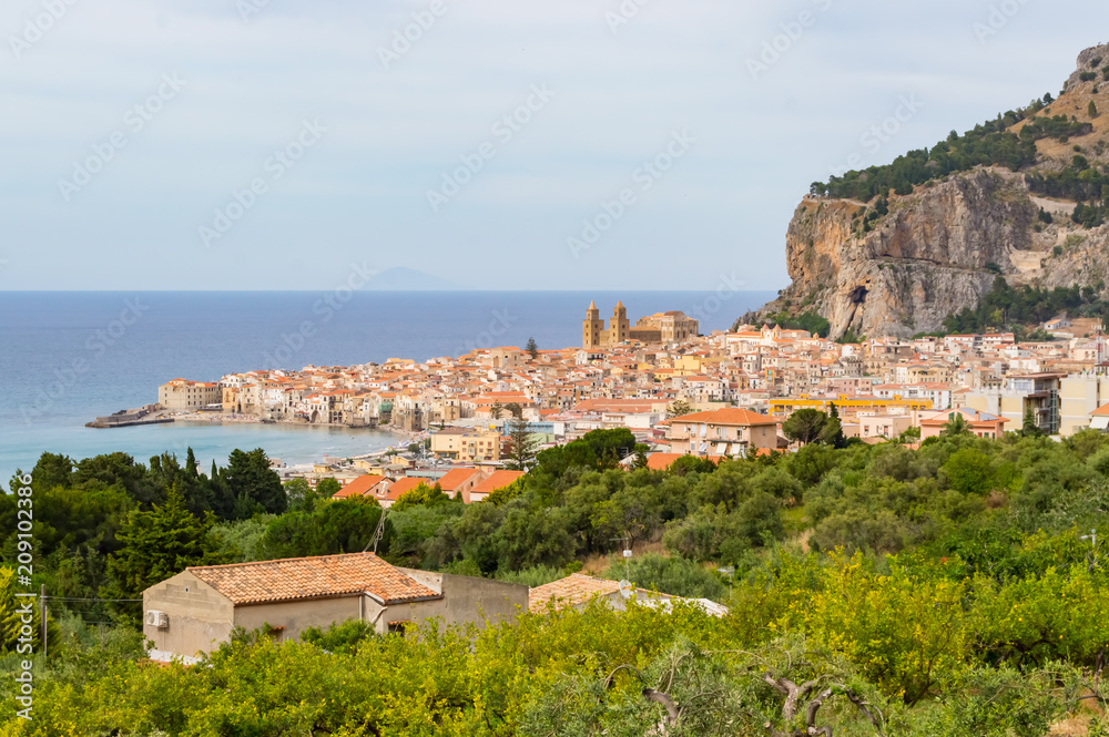 View of the city of Cefalu, its basilica and its rock