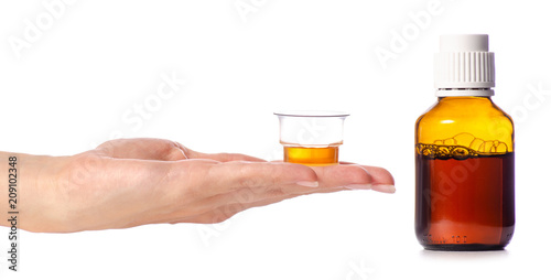 Bottle of syrup in hand medicine on white background isolation