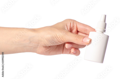Nasal spray for nose in hand on white background isolation