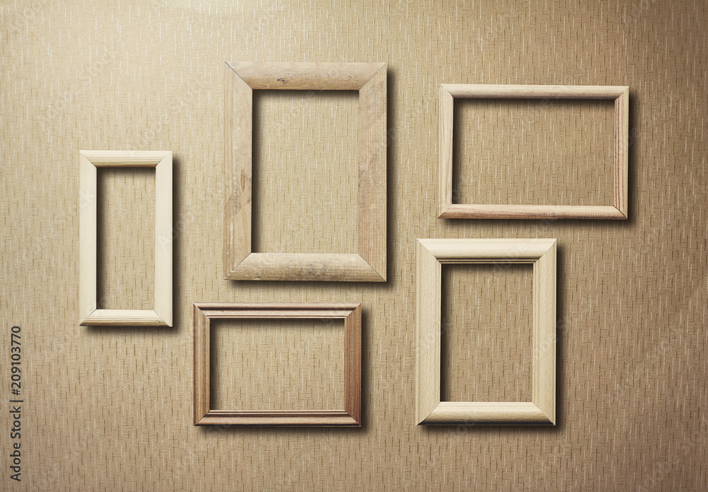 Fototapeta premium old frames on wooden wall