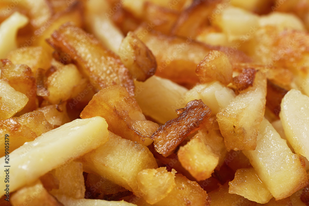 Fried potatoes close-up. Food background. Fried potatoes close-up. Food background.