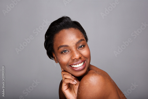 Close up attractive black woman with hand to face