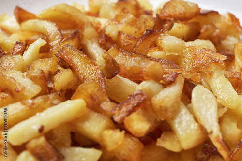 Fried potatoes close-up. Food background.