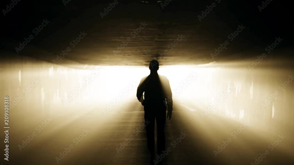 Walk in tunnel to the light. Afterlife concept in slow motion.