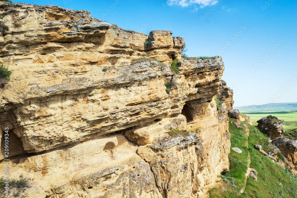 Rock formations from sandstone in the steppe relief Rock formations from sandstone in the steppe relief
