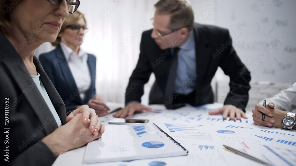 Fototapeta premium Angry male boss screaming at his subordinates, dissatisfied with work, stress